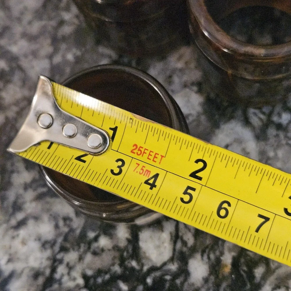 Set of 3 brown swirl like tortoise‎ plastics or bakelite MCM napkin rings